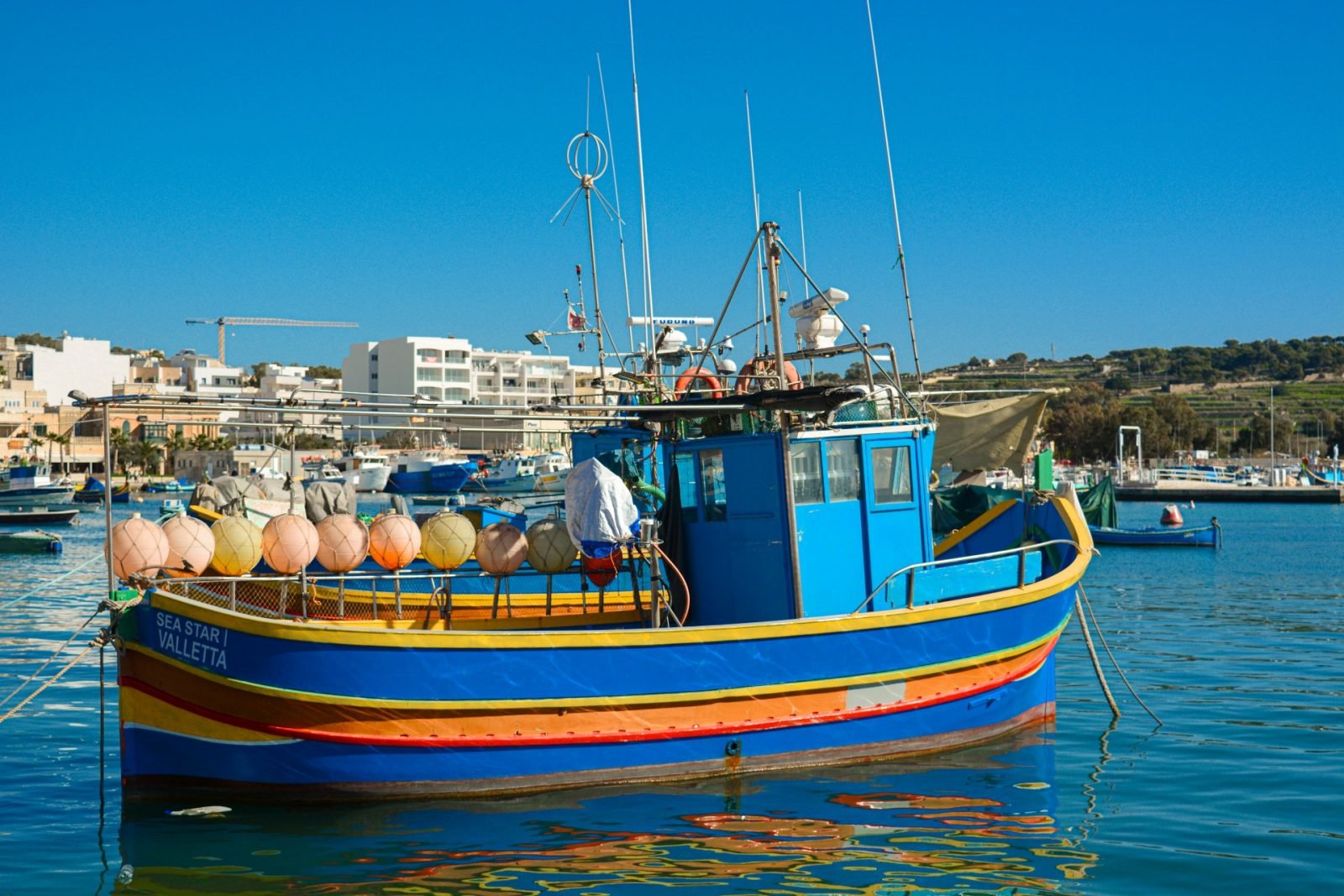Marsaxlokk, wioska rybacka, łódź i oko proroka