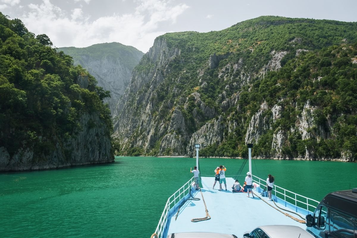 Admire the majestic views while cruising on Lake Koman in Albania