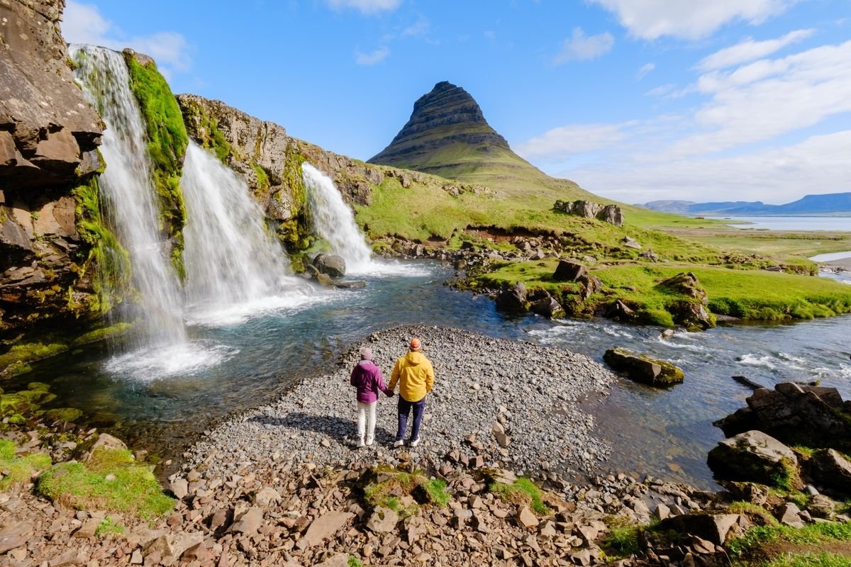 Waterfalls with Kirkjufell Mountain visible in the background