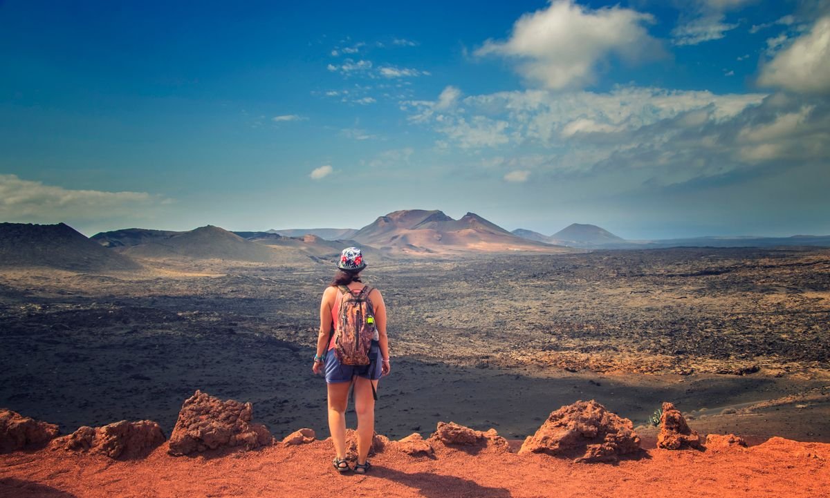 A tourist observing Timanfaya National Park in Lanzarote